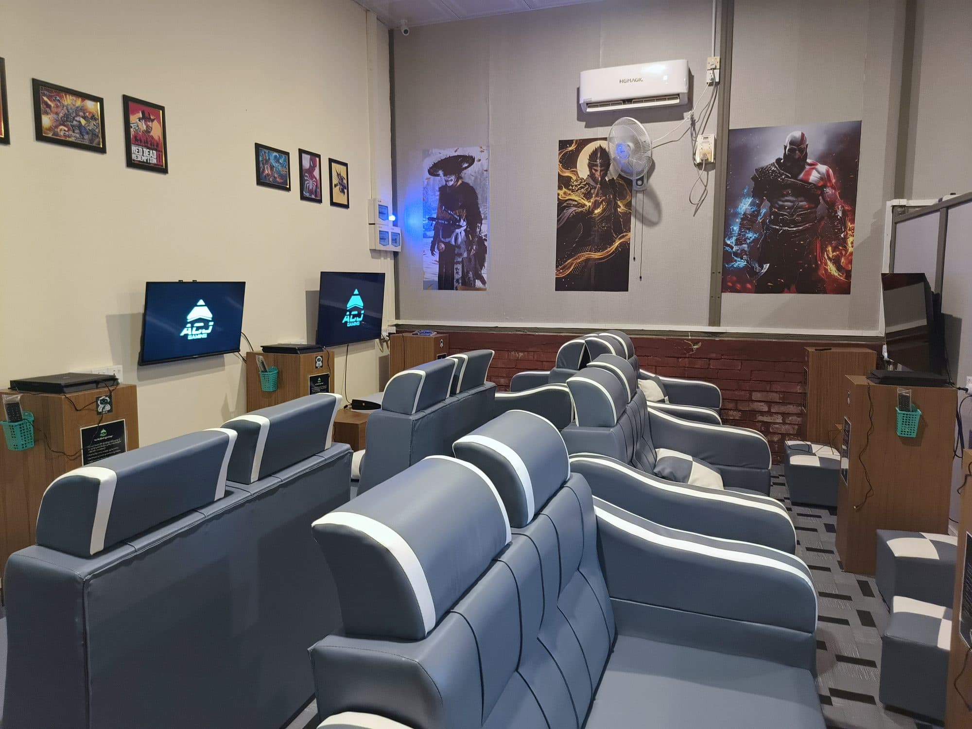 The ACJ Gaming lounge with sofas facing the screens